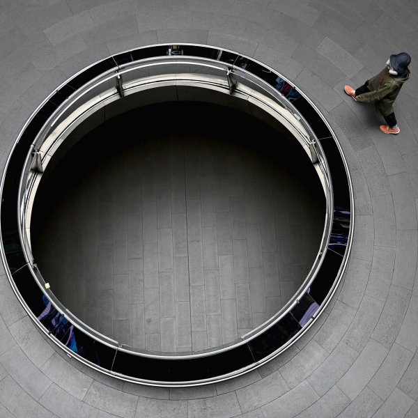 A commuter walks through a nearly empty Fulton Street subway station complex New York City, on July 7, 2020.